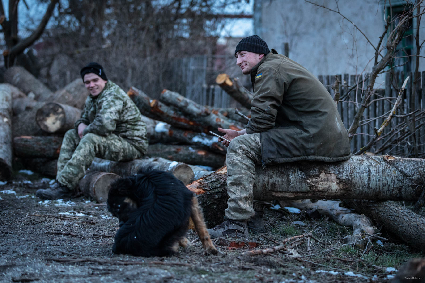 Driver, Vasily, and sailor, Dmitry, rest after harvesting firewood. Shirokine, March 2018.