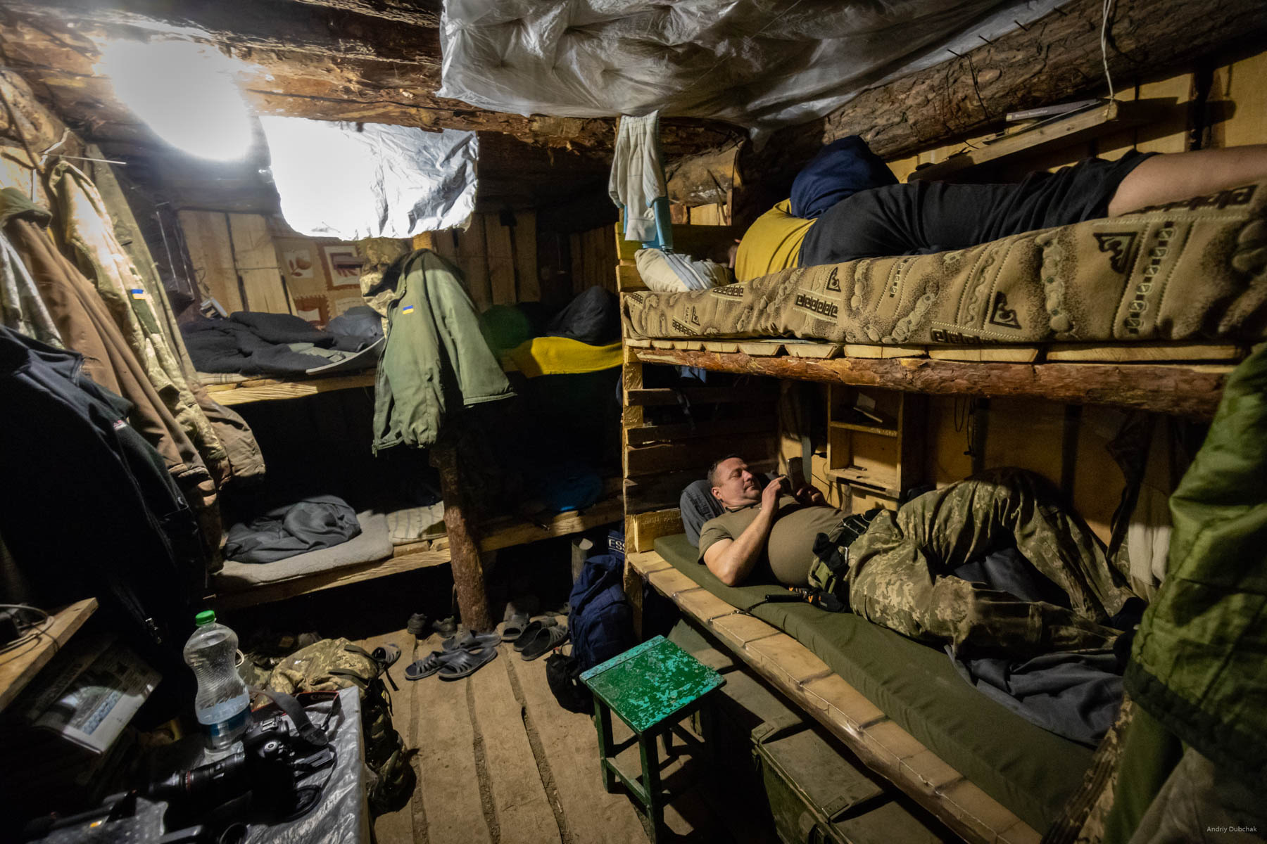 After a four-hour watch, we return to a “sleeping dugout” that contains 10 beds. The warriors rest here between duty calls. Standard dugout accommodates from 6 to 10 fighters. There are, of course, smaller. According to the rules, there are two entrance/exits. It happens that a dugout has several rooms(It depends on how big a hole was dug and how much construction materials were available). We even saw «shelters-gyms. »   District of Popasnoy, December 2017
