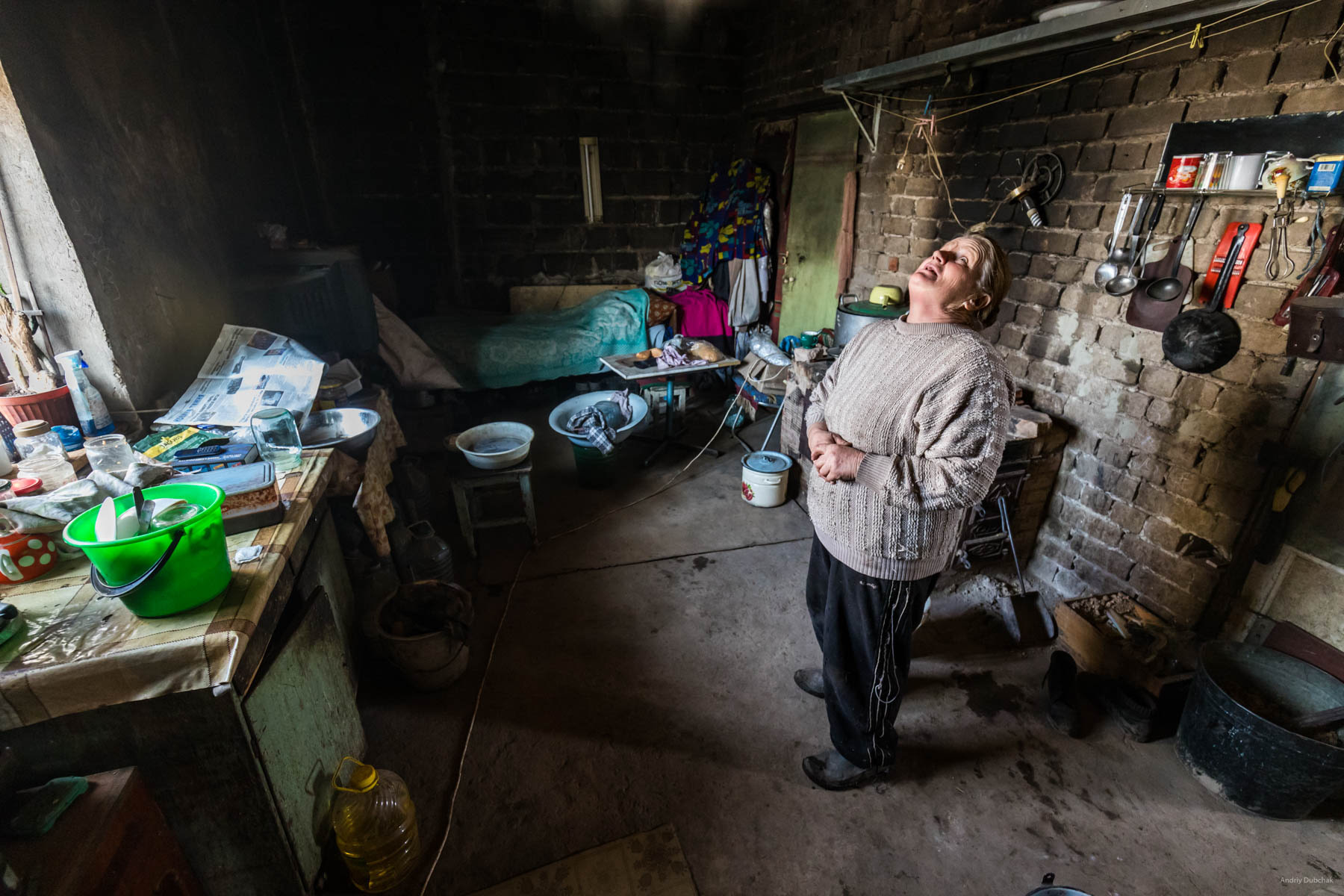 In Vodyane, Spring of 2018, seven families were permanently residing (10 people). They farmed the land, raised livestock - goats (milk that they sold or changed for food from soldiers), pigs and poultry. Only a small amount of assistance was received from international humanitarian organizations. There was no separate assistance from the Ukrainian state.  One of them is baba “Zoya" (military called the woman that way). The husband and son of the woman died, she lived alone. After the fighting began, other her relatives - daughter - and the four grandchildren left for Russia. Marine_22.jpg 