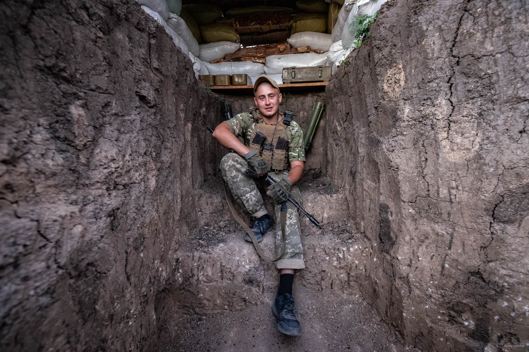 Section commander, "Yarik," is in the newly built gun nest on the front in the fields, near Vodyane. Vodyane, June 2018.