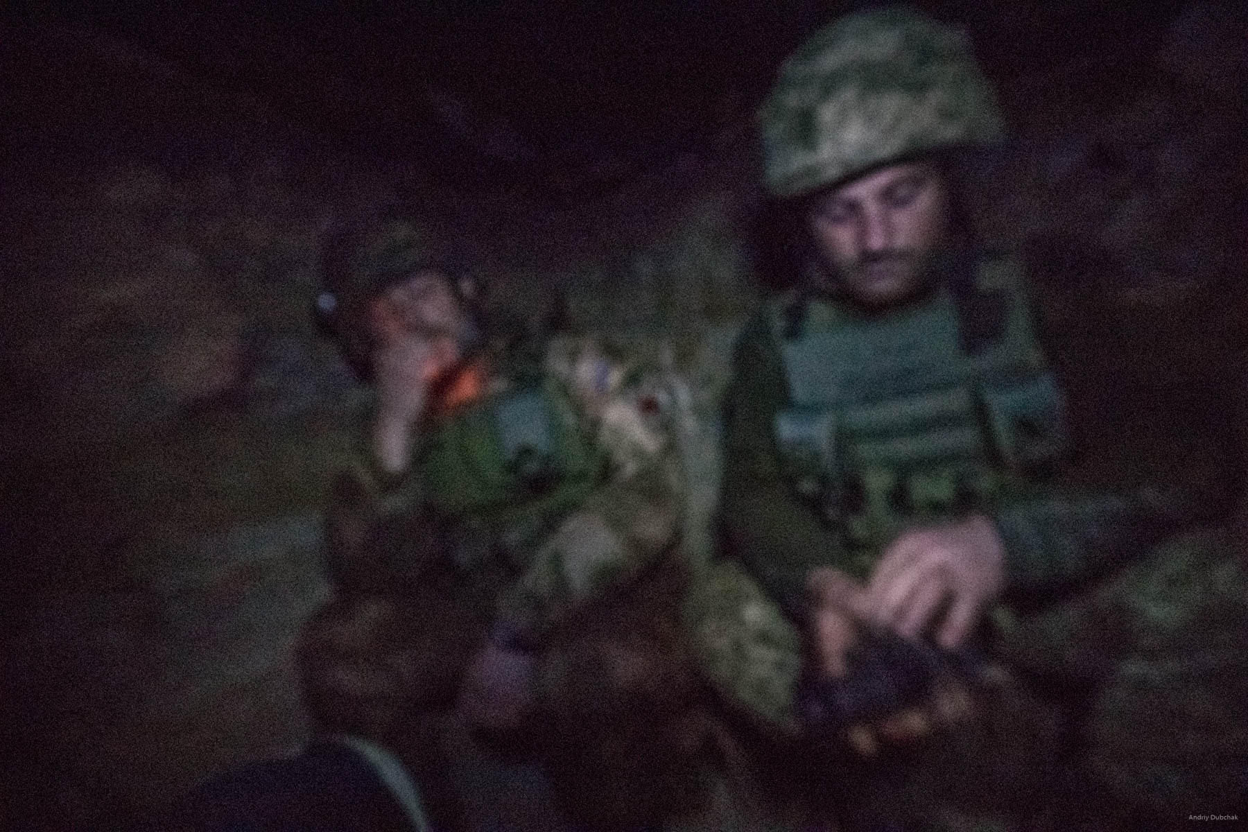 Night at “observer.”   In total darkness of a dugout, Mykhajlo smokes, while on watch on his frontline position. Experienced “Didick” is to the right of him.  Night turns out to be quiet. We are having a conversation. Repeatedly, in total darkness, either Mykhajlo or “Didick” stands up and look out through a gun-slot. A night vision scope helps to monitor the situation. “We regularly experience “nightmares”: 12,7 millimeters, sometimes 14,5 and 7,62 all the time. There were cases, when 5,45 mm bullets flayed in through the gun-slot,” says Didick, fidgeting with a night vision scope. ‘When I come home, the question that strikes me most - “When will the war end?” How do I know? We do everything what depends from us. However, there is one thing that I will never get used to – when you have to inform relatives that their son, or husband, or other family member is no more. When that mobile rings and you have to answer, and you can hear a female voice saying, “Hello! Hello! Sashku, Sashku, how you? Hello! Why are you silent?” Moreover, you stand there, not knowing with what to begin. You talk some nonsense, trying to express your apologies and sympathies. In such moments, my voice trembled, with hands and feet wobbly. There would be silence on the other end. Then you would hear weeping and hysterics. That was the hardest thing,” recalls Mykhajlo. Sometime later, there is a flare in total darkness. Sound follows in a few seconds. It is an “exit.” Guys monitor the situation. Enemy fired AT mounted grenade launcher at positions of an adjacent friendly brigade.  District of Popasnoy, December 2017