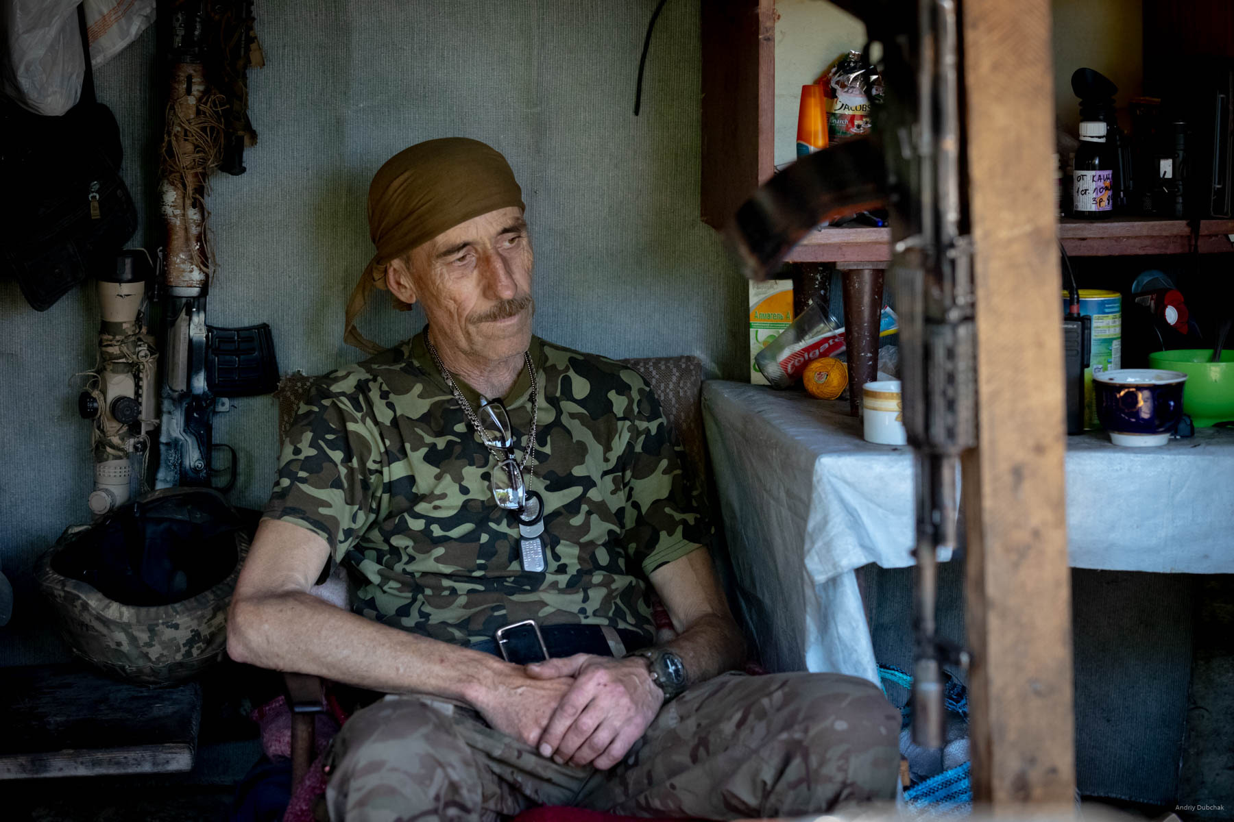 We visit one of the military positions. Soldiers treat us to coffee. Mainly middle-aged warriors held these defensive positions. In the photo is a warrior soldier named “Mamay.” He is in the war since March 2014. The man is 59 years old.  He performed many functions: physician, field engineer, cook, fighter. Settlement Pivdenne, near Gorlivka on June, 17th, 2018